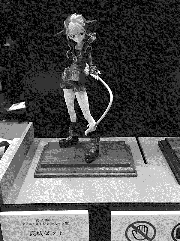 Photo of 13 Tousei's Takajou Zett zoomed out to capture the placard with the artist's info in front.