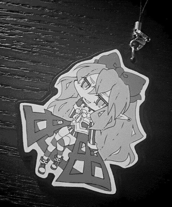 An acrylic pendant of one of UMA WARS' antagonists.