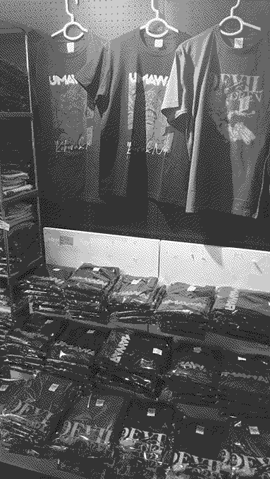 A rack of t-shirts for Devil Children and UMA WARS.